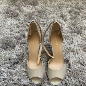 Cream patent leather heels.